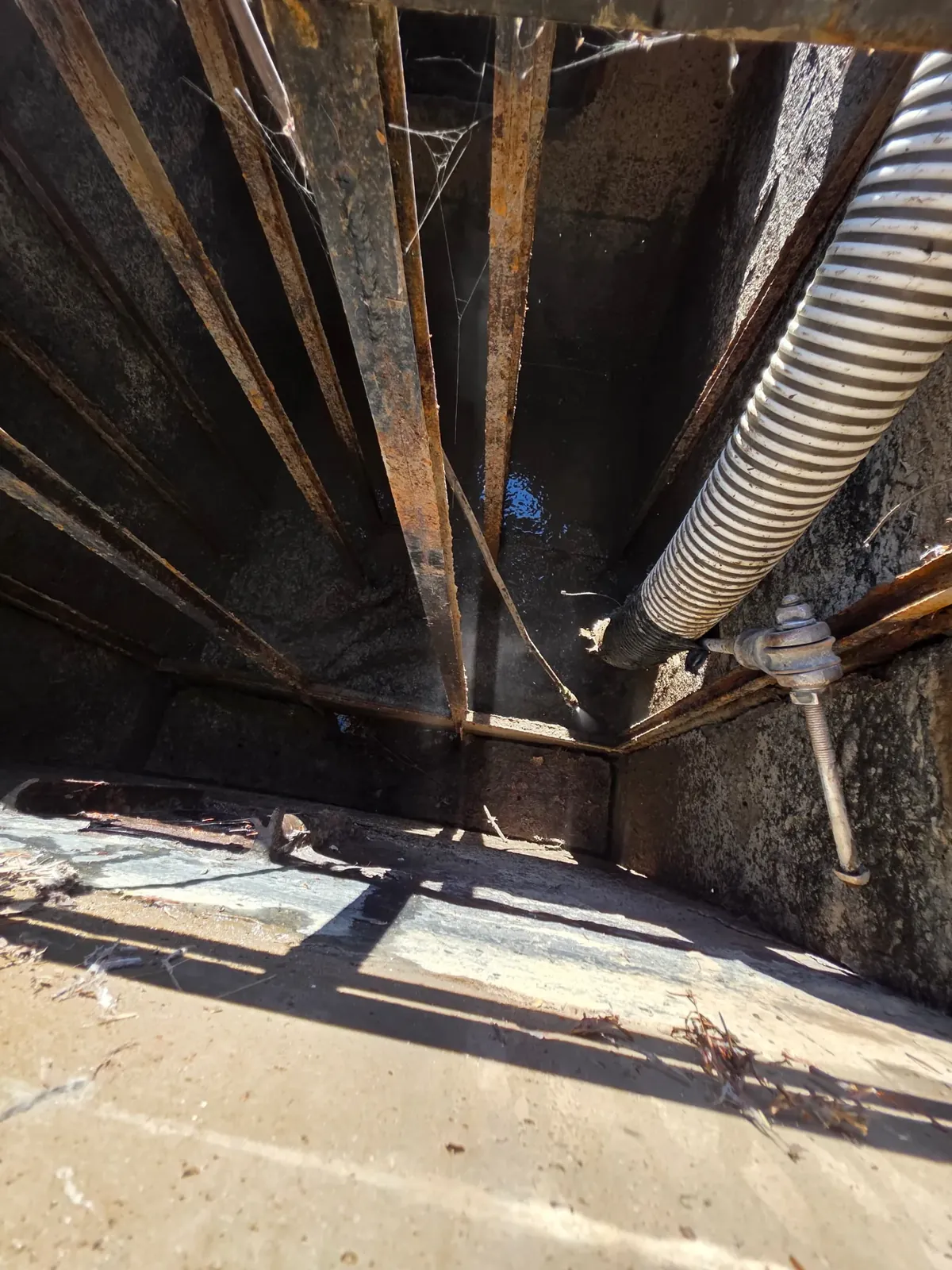 Vacuum hose and cleaning equipment inside a structure